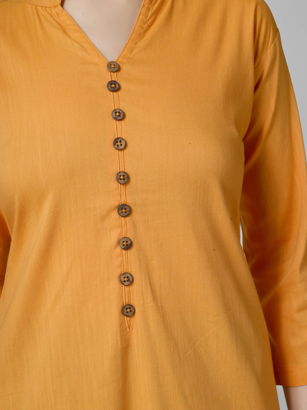 Saffron Solace: Mustard Yellow Solid Cotton Kurti with Wooden Button Detail